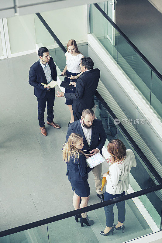 Group of business people in the office building lobby